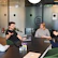 Project manager discussing OEM project details with industrial designers around a table.