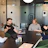 Project manager discussing OEM project details with industrial designers around a table.