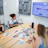 A professional sourcing team discussing product options in a bright office.